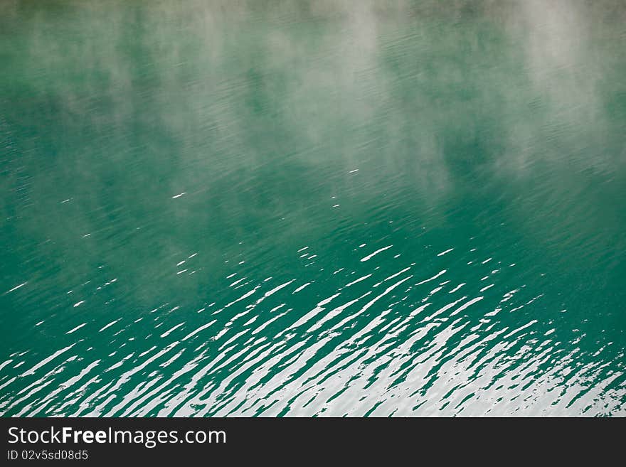 Mist rising from mountain lake