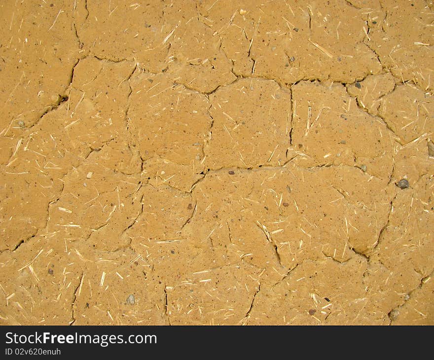 Cracked cob wall with straw