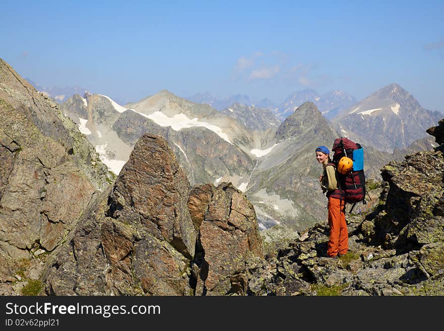 Backpacker Girl In A Mountains