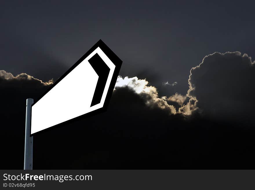 Photograph of signpost against dark moody sky. Photograph of signpost against dark moody sky