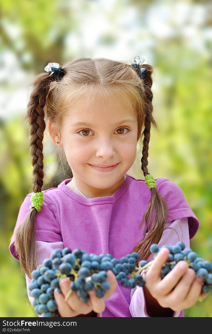 Girl Gives Bunches Grapes