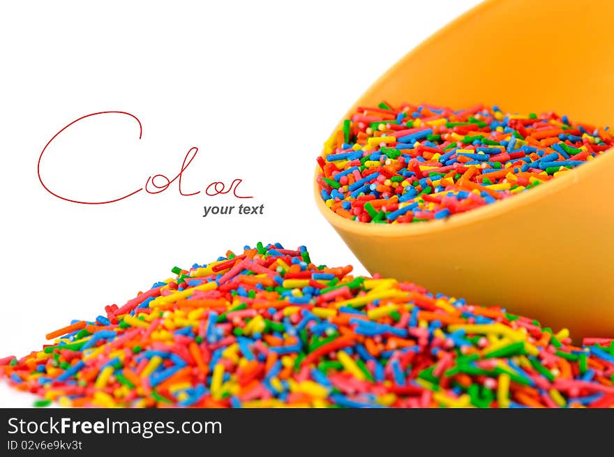 The colored candies on white background