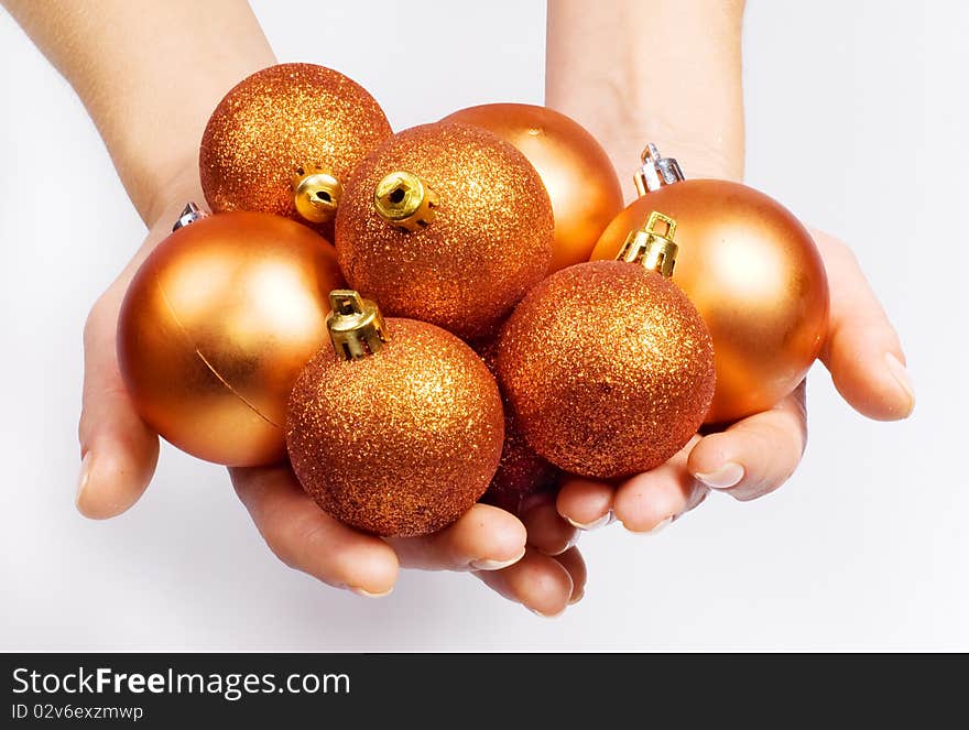 Female hands with Christmas spheres