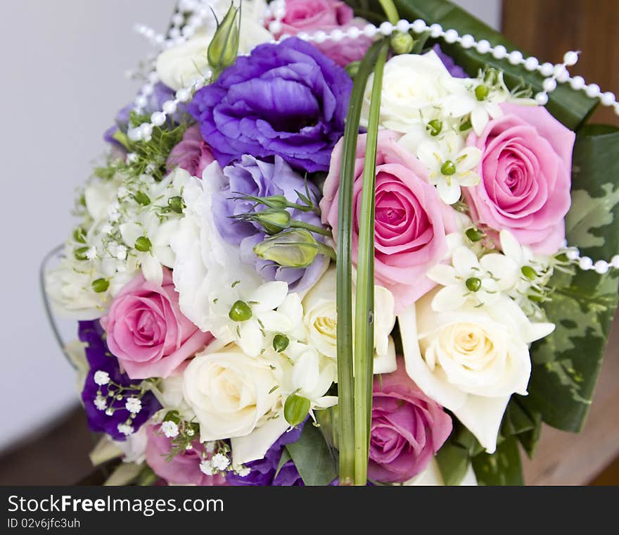 Colorful wedding bouquet with pink and white roses