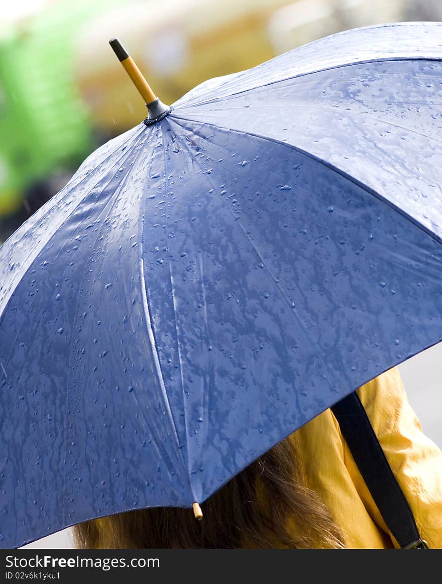 Woman with blue umbrella