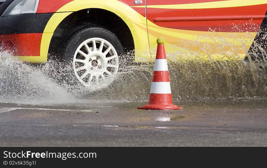 Racing car tires entering water. Racing car tires entering water