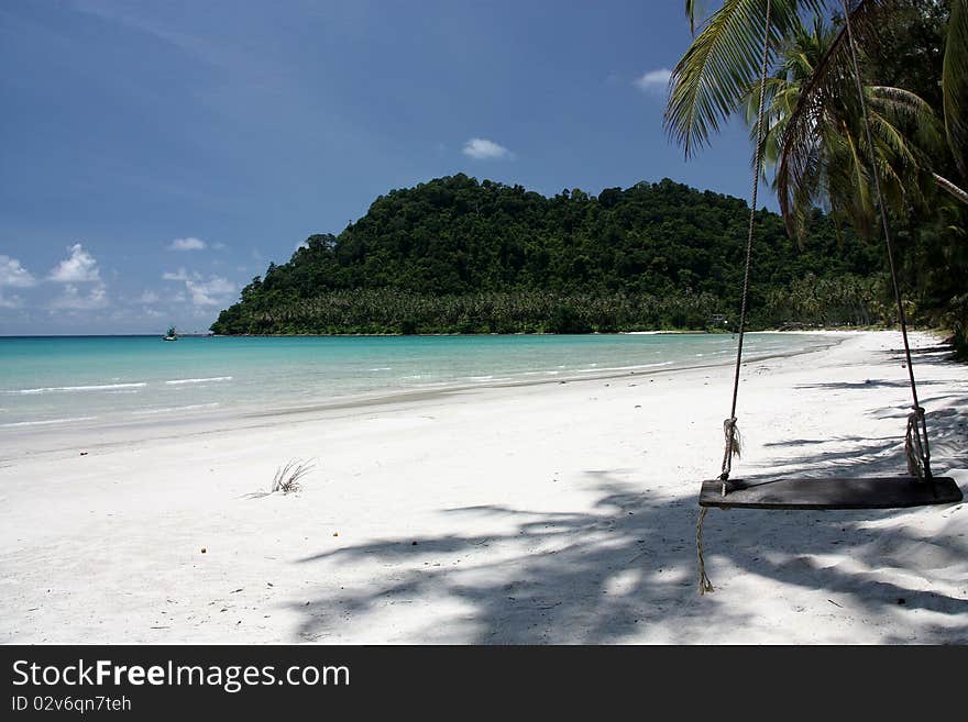 The swing with a white sand beach.