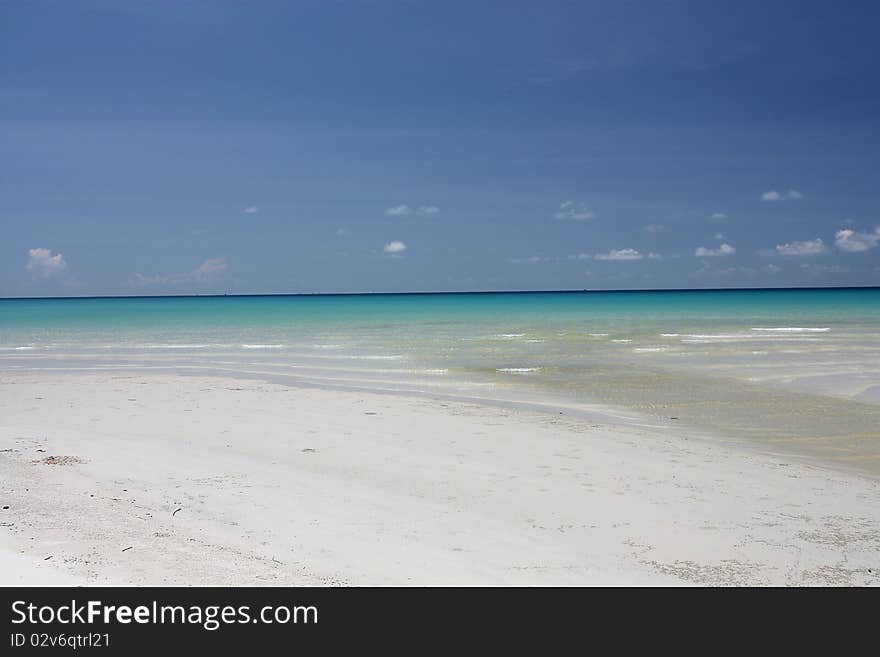 The blue sky with the white sand beach. The blue sky with the white sand beach.