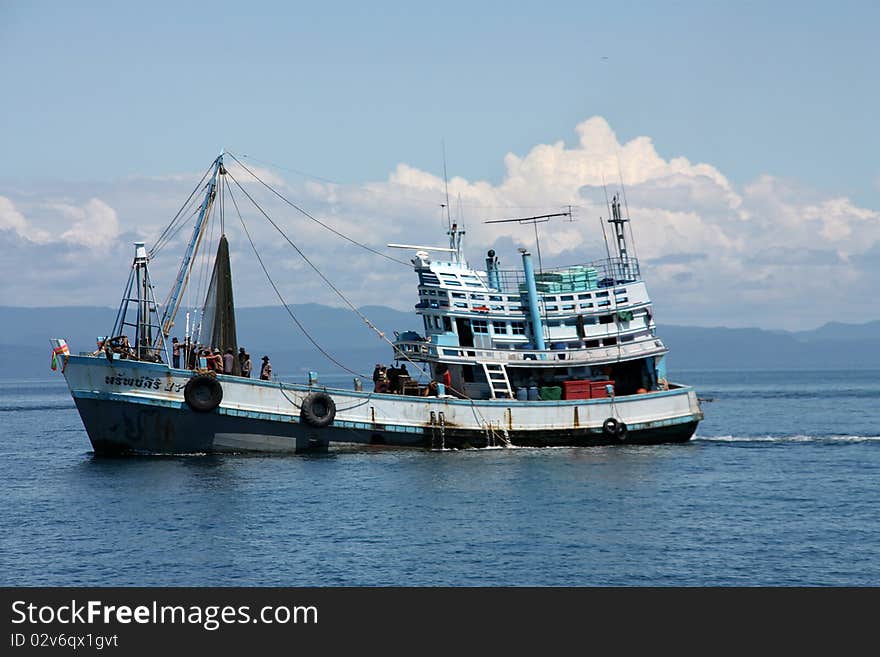 The fisherman boat are fishing.