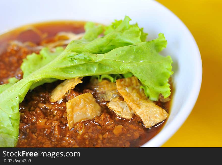 Sumptuous looking Chinese style vegetarian noodles generously topped with meat sauce. Suitable for concepts such as healthy lifestyle, and food and beverage.