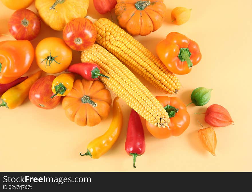 Fresh healthy vegetables on yellow background. Fresh healthy vegetables on yellow background