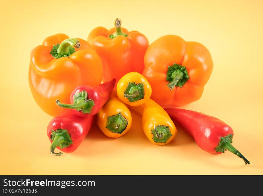 Hot chili peppers and big sweet peppers. Hot chili peppers and big sweet peppers