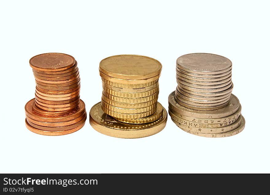 Piles of coins isolated on white background