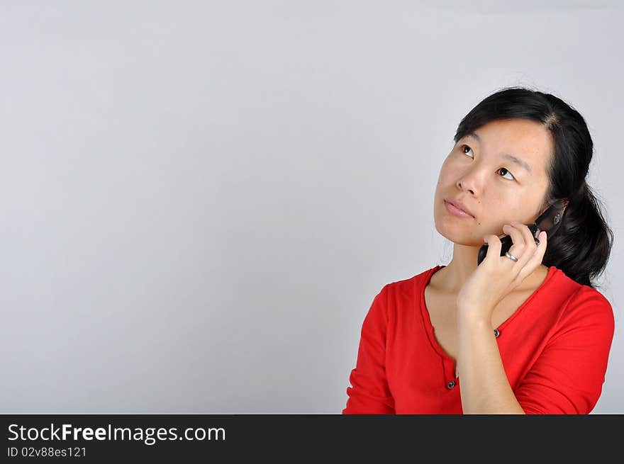 An Asian girl on the phone，which taken in China