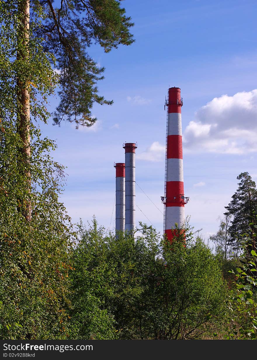 Pipe of thermal power plant and trees