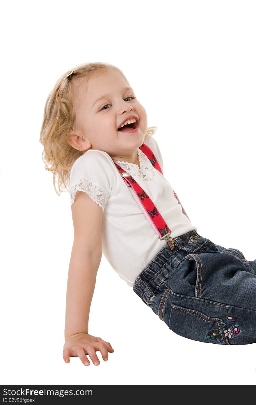 Happy little fashion model sitting on white background