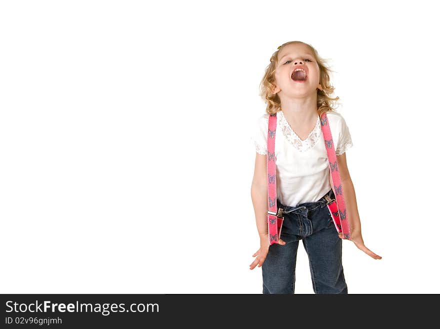 Beautiful little fashion model on white background screaming and stretching her red suspenders out to the sides