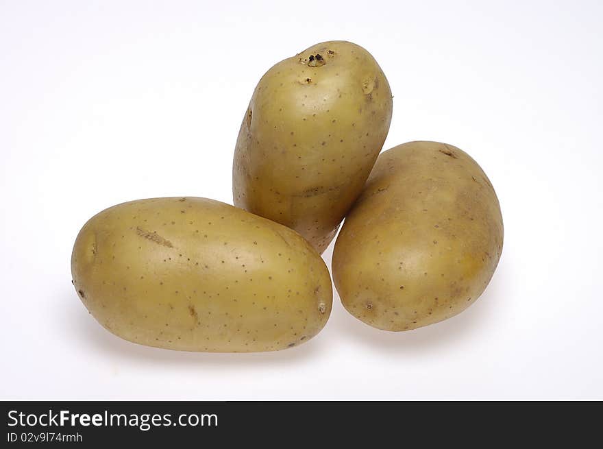 Three potatoes on white background.