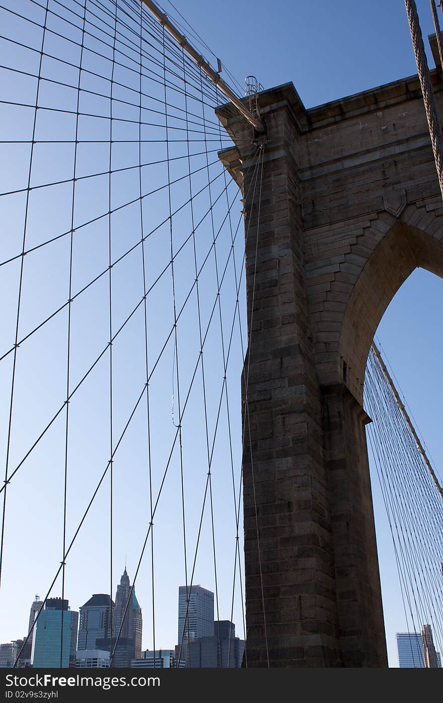 Angled view of the cables of Brooklyn Bridge with Lower Manhattan beyond