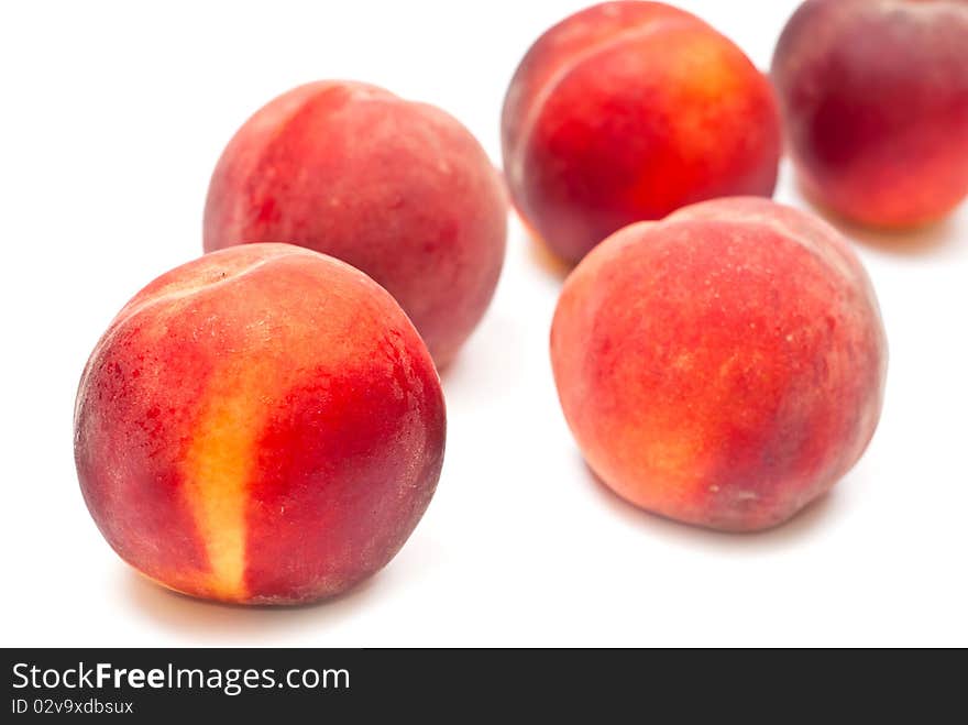 Fresh red peaches isolated on white background