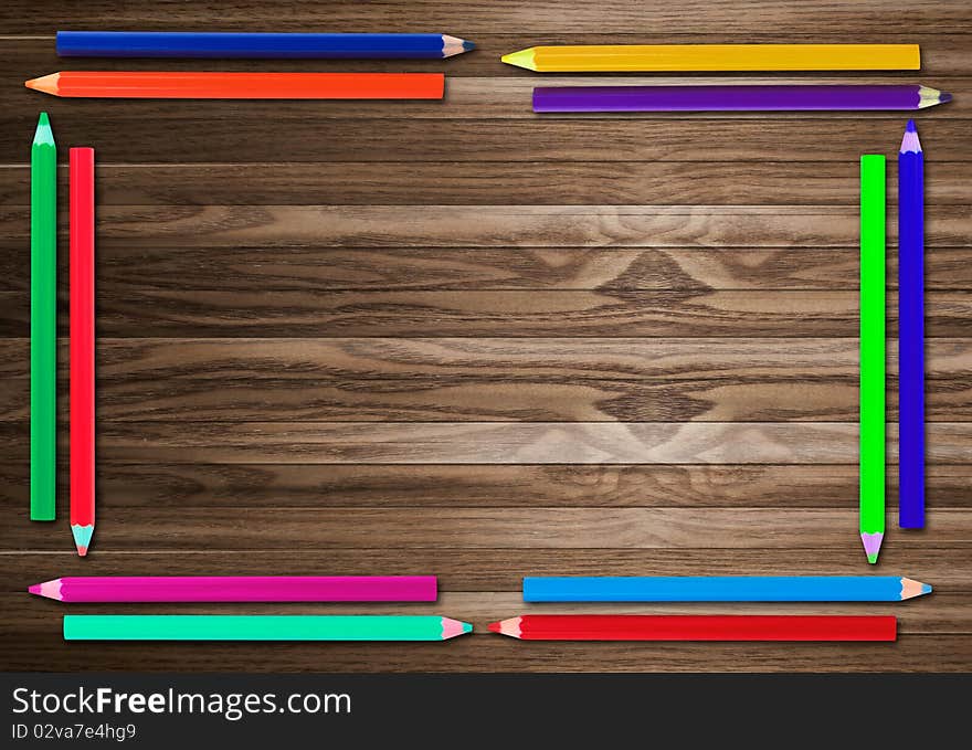 Pencil Frame  on old wooden background