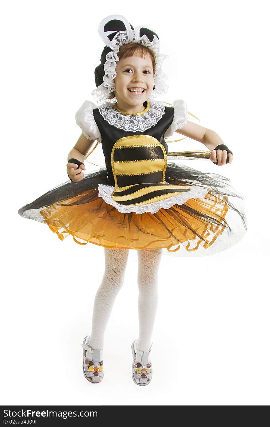 Small girl is bee costume. Flying bee.