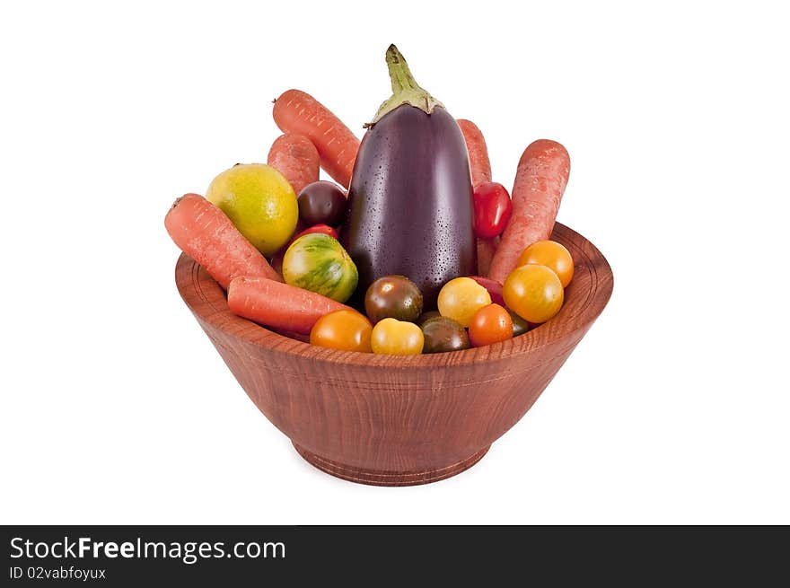 Fresh vegetables in a bowl made of wood. Fresh vegetables in a bowl made of wood.