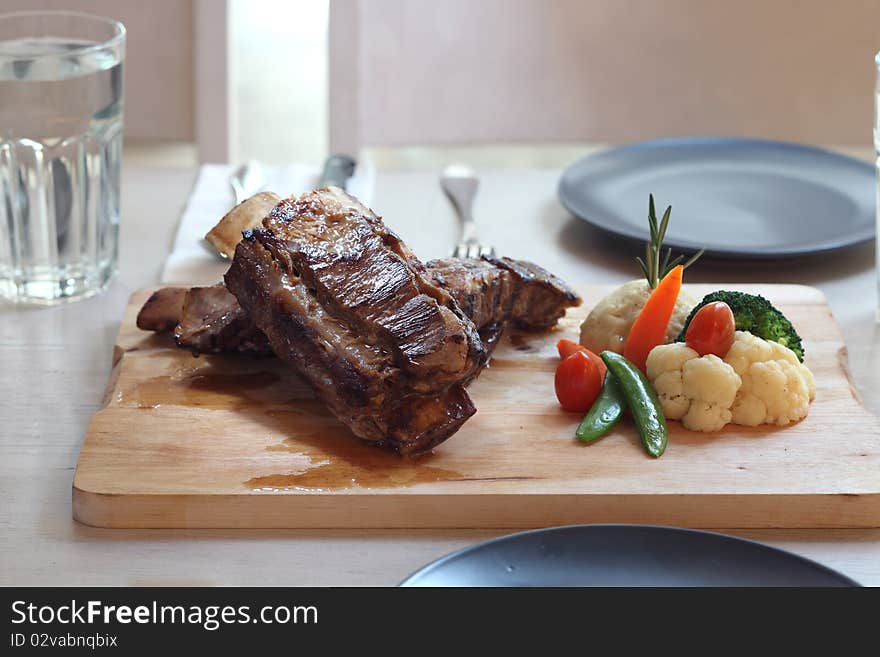 Grill juicy beef rib serve with vegetable. Grill juicy beef rib serve with vegetable