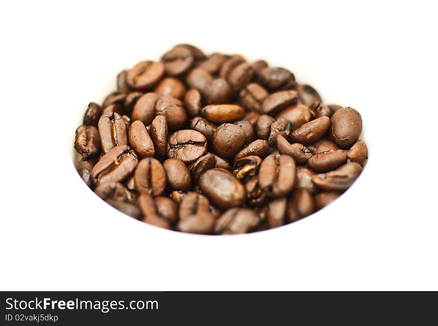 Coffee beans in the white cup