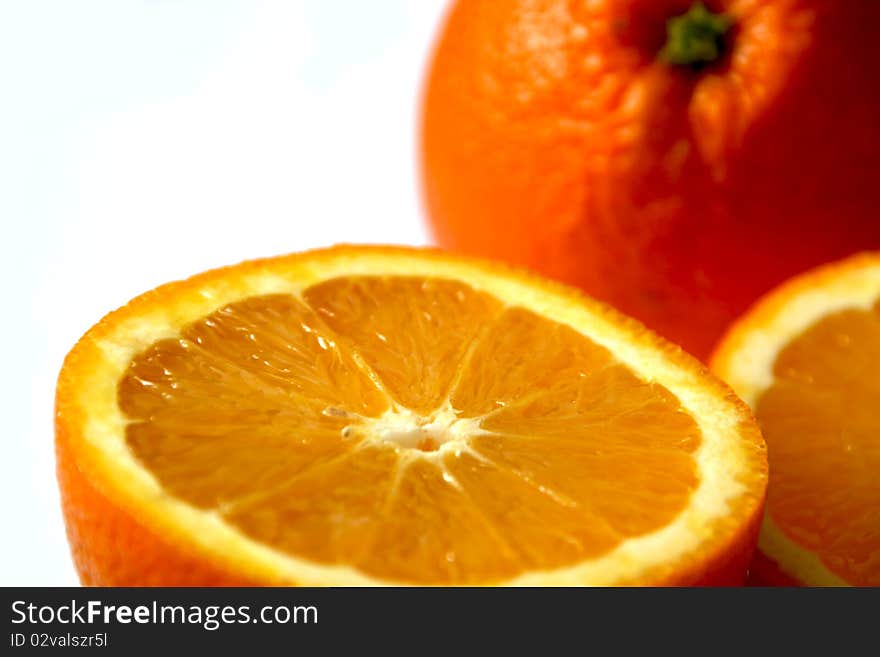 Close-up view of half of oranges and one more orange