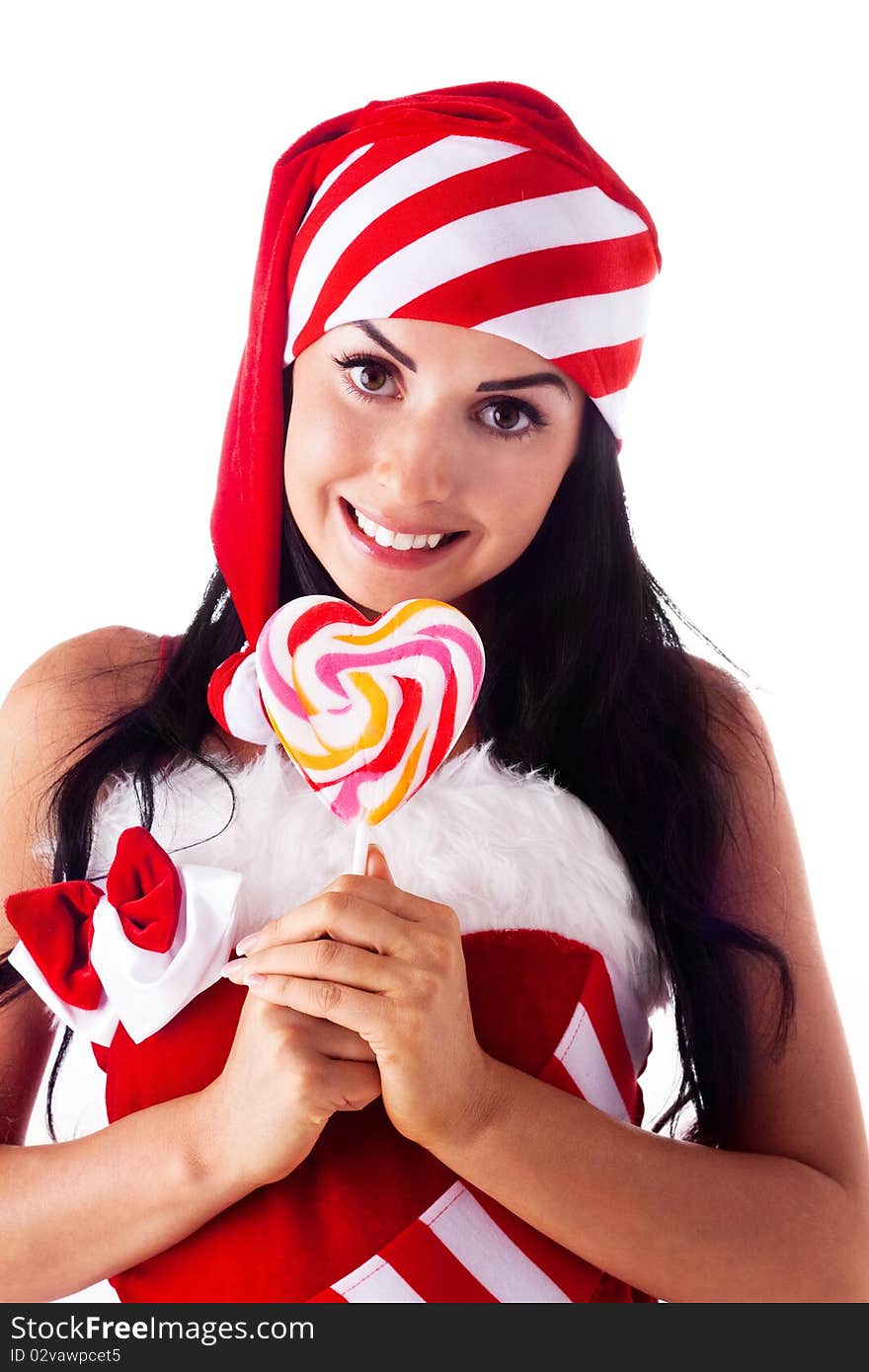 Santa girl holding a lollipop.