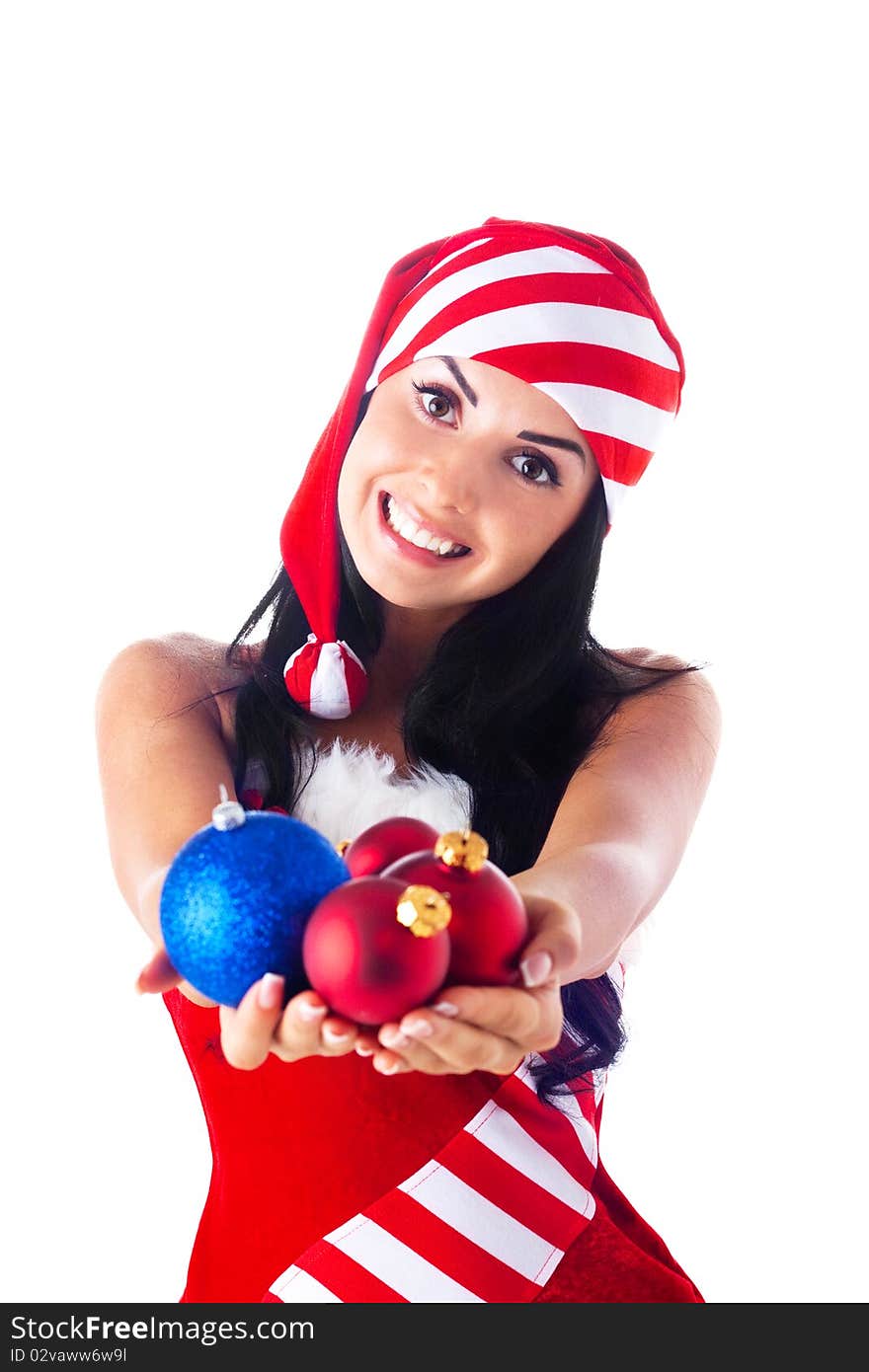 Santa girl holding a Christmas ball, Christmas toys. Holidays New Year and Christmas