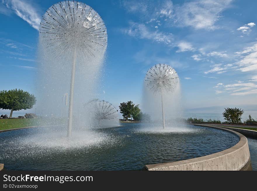 Nice fountain in the town of Romanshorn, Switzerland, Lake Constance  in background