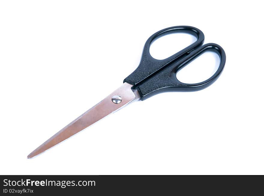 Scissors with black plastic pens on a white background