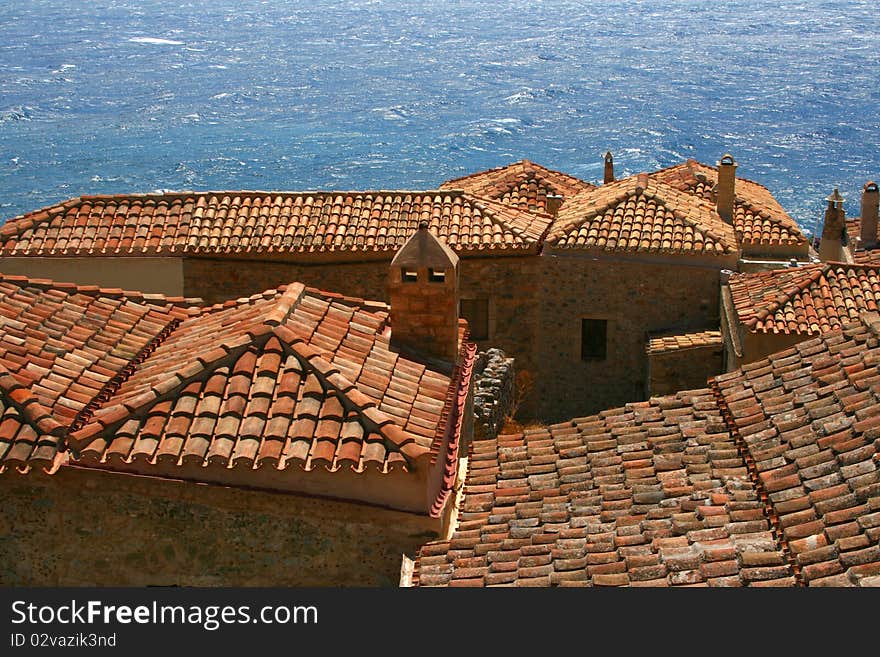 Red roofs and Mediterranean sea in Monemvasia, Greece. Red roofs and Mediterranean sea in Monemvasia, Greece