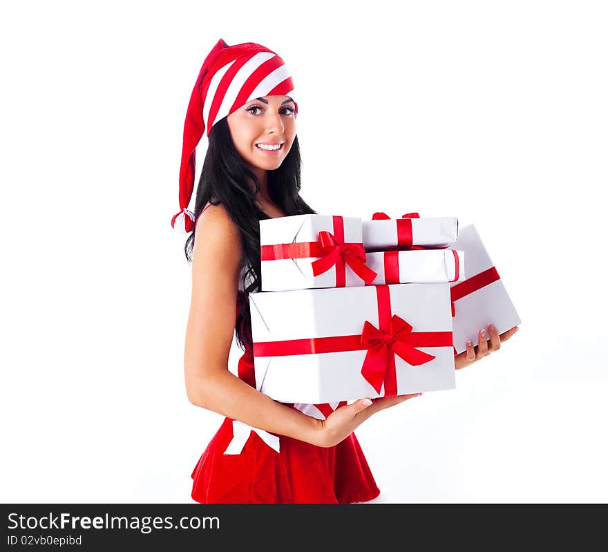 Beautiful young brunette woman dressed as Santa with presents in her hands. Beautiful young brunette woman dressed as Santa with presents in her hands