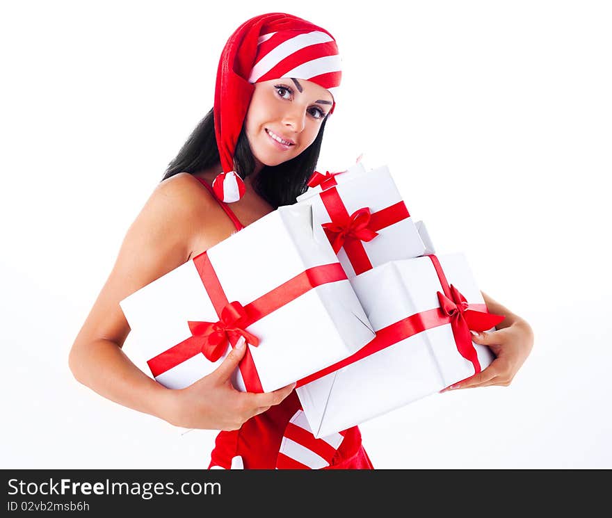 Beautiful young brunette woman dressed as Santa with presents in her hands. Beautiful young brunette woman dressed as Santa with presents in her hands