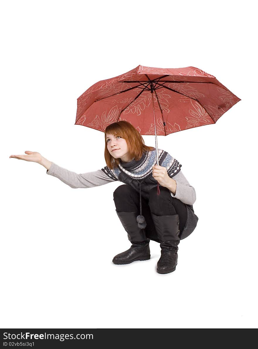 Girl in knit dress with red umbrella sitting