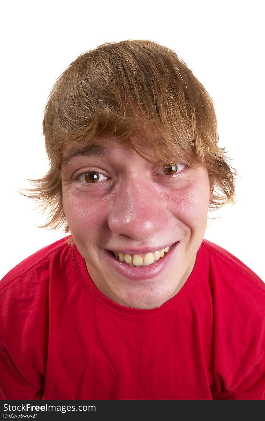 Young happy teenager portrait isolated over white background (wide angle lens shot)