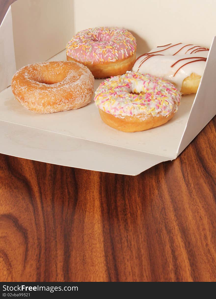 Box of doughnuts on an office desk