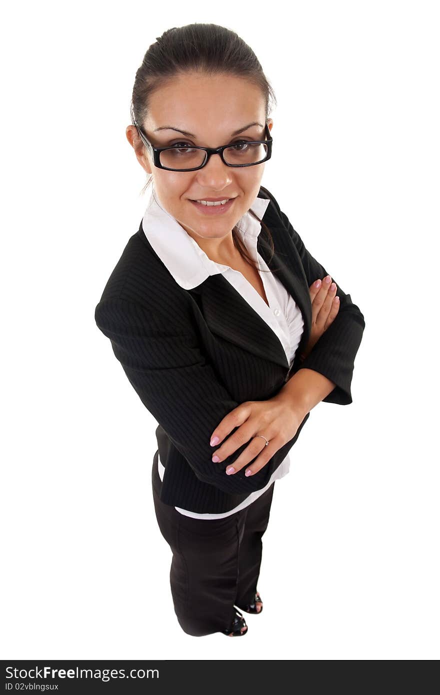 Happy business woman with her arms crossed (isolated on white) - wide angle shot