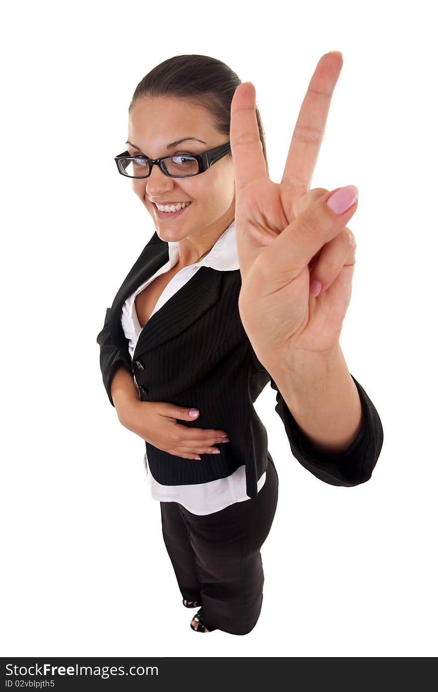 Wide angle picture of an attractive business woman making her victory sign