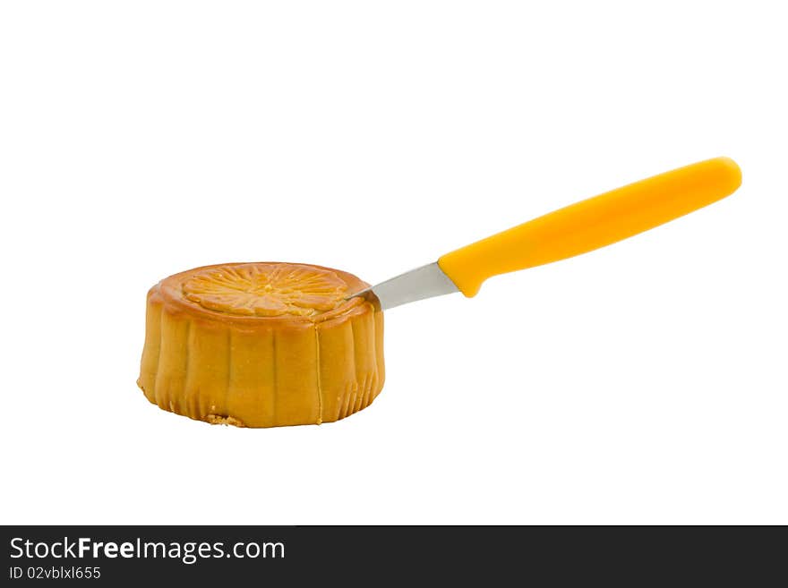 The moon cake with knife. The moon cake with knife