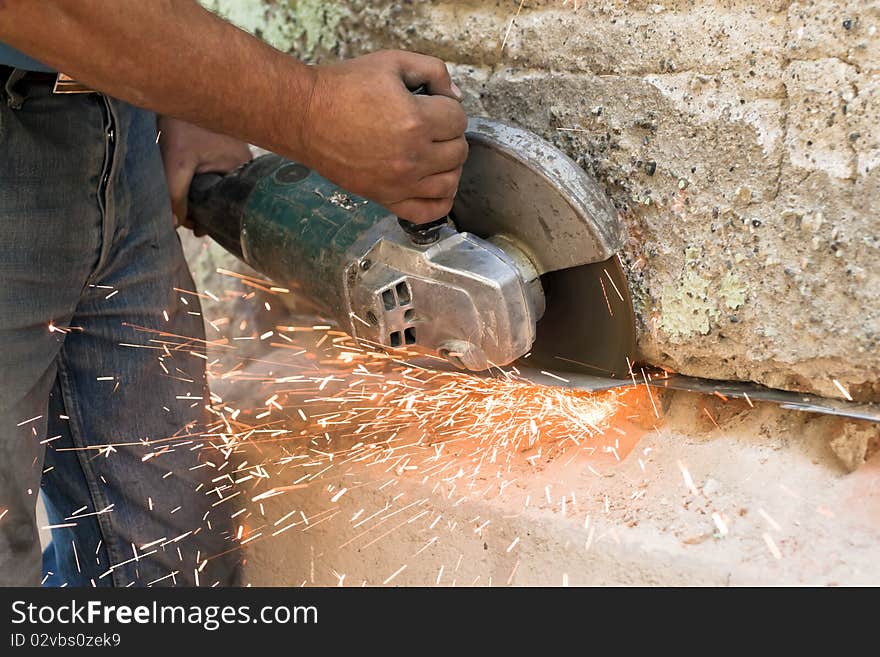 Male workers in the iron cut machine.