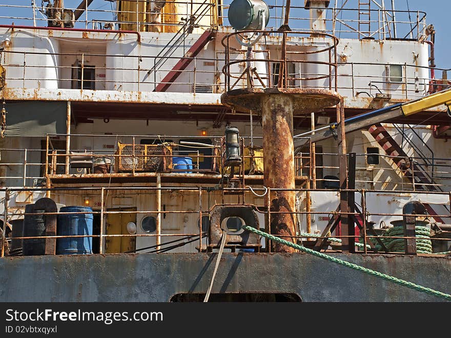 Rusty superstructure of a ship in port - Partial view