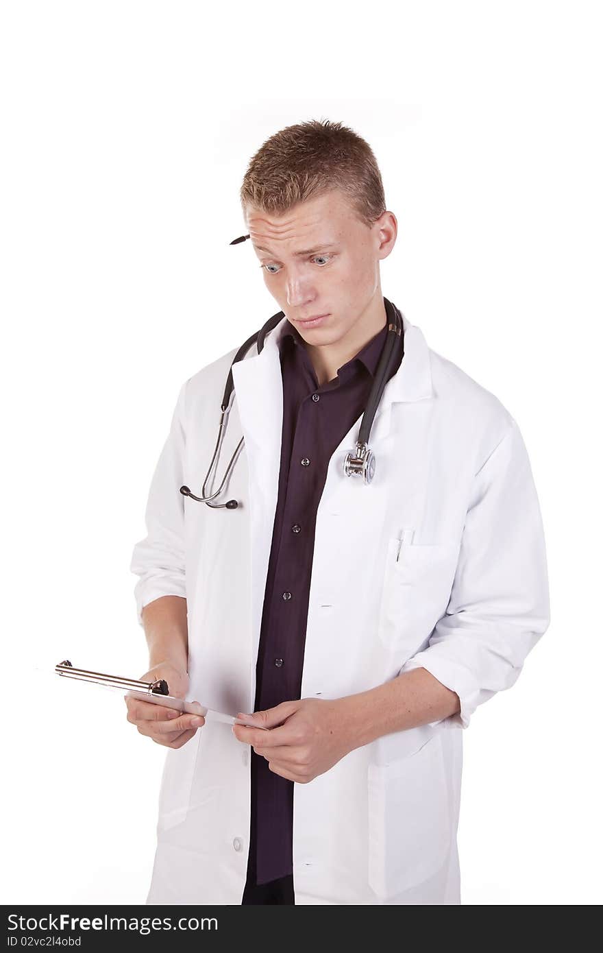 A male doctor looking at his chart with a surprised expression on his face. A male doctor looking at his chart with a surprised expression on his face.