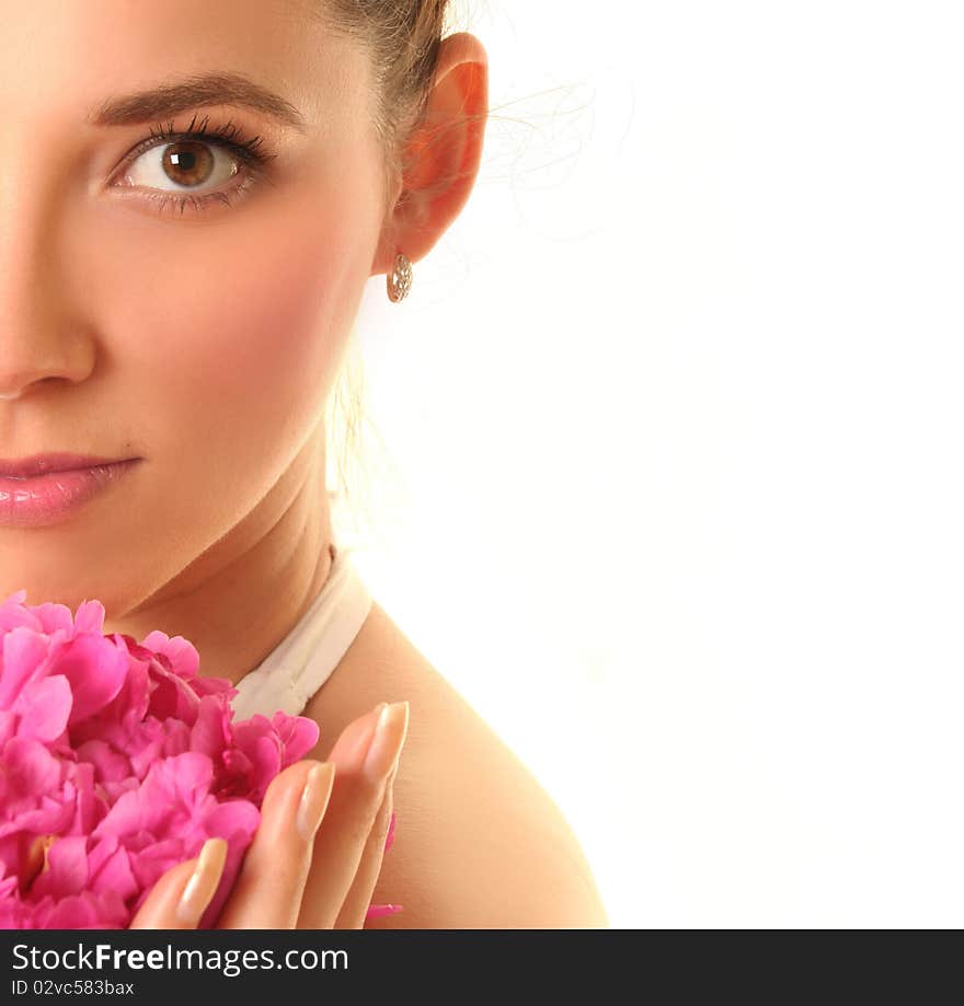 Beautiful young woman with pink flower isolated on white. Beautiful young woman with pink flower isolated on white