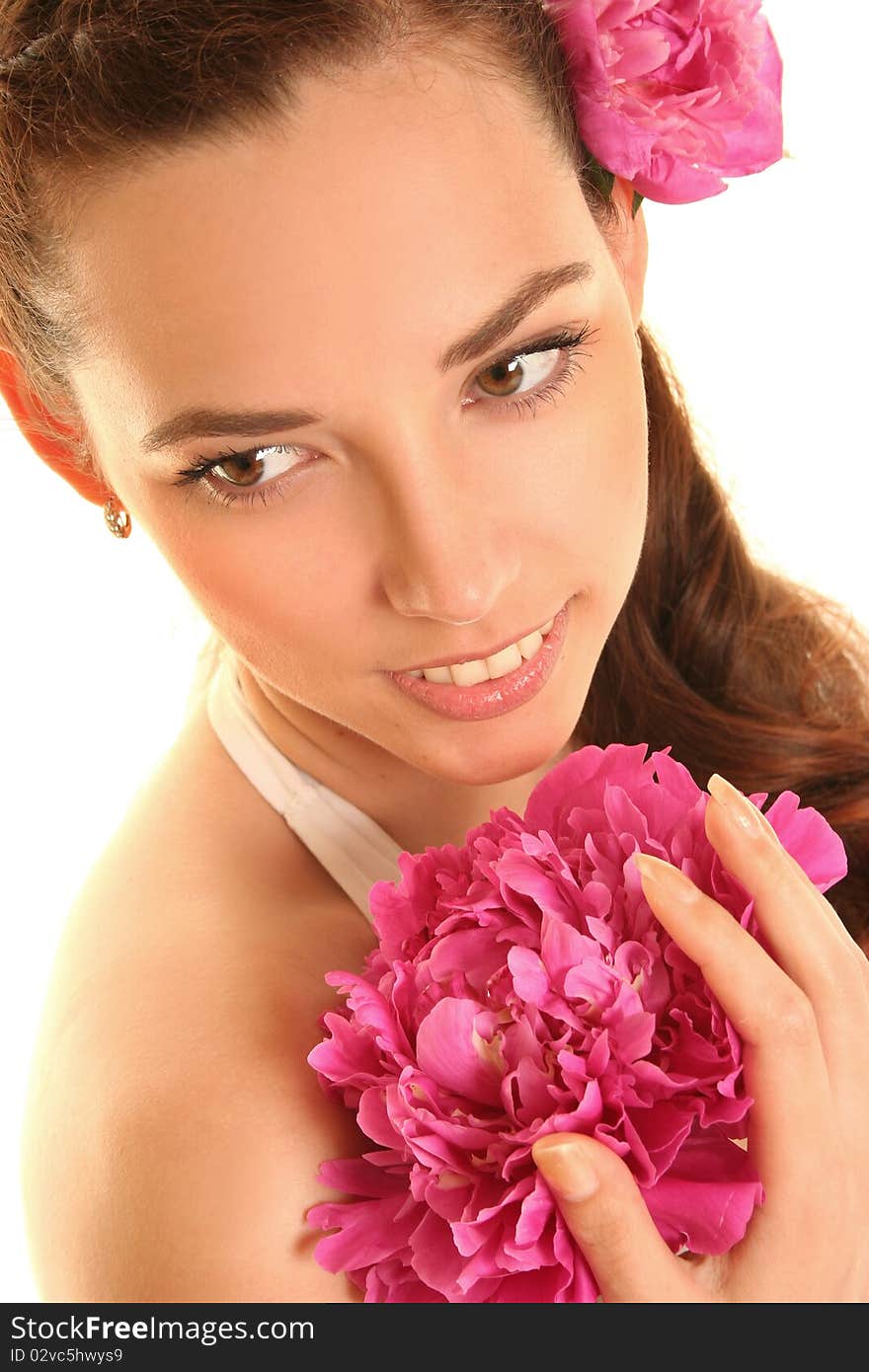 Beautiful young woman with pink flower isolated on white