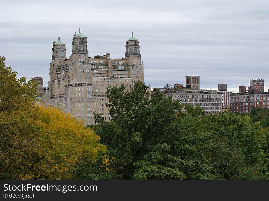 This is a view of the Manhattan skyline over some trees. This is a view of the Manhattan skyline over some trees.