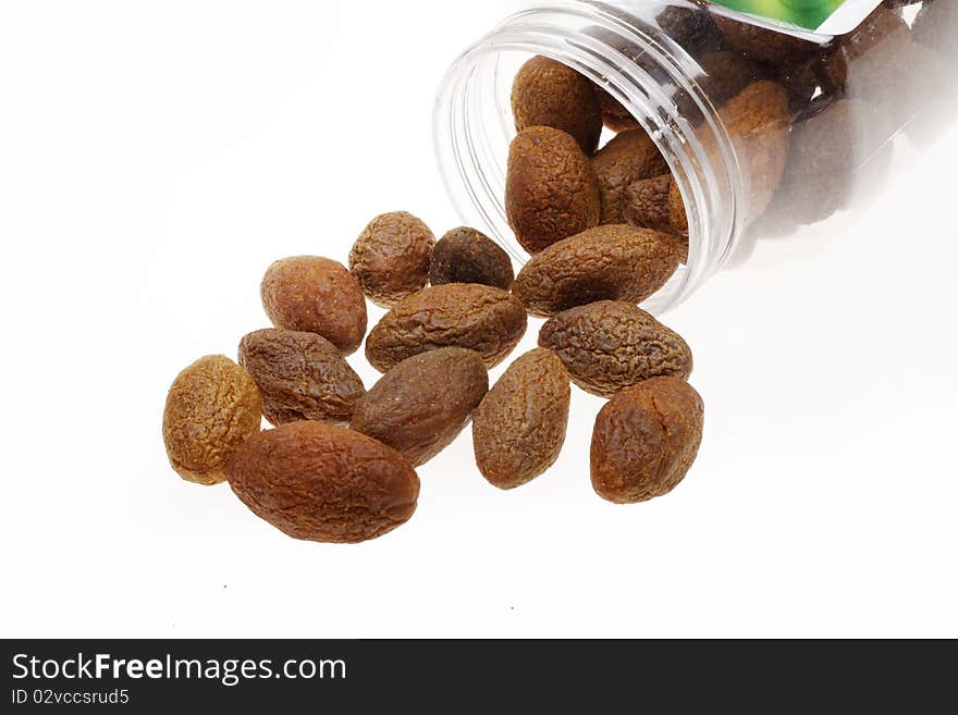 Some olives with glass jar on white background. Olive fruit rich in calcium and vitamin C